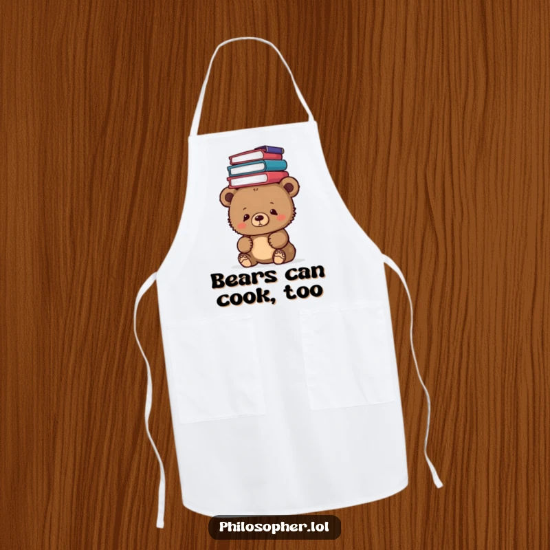 Funny bear cub balancing philosophy books on its head while wearing an apron, ready for kitchen tasks with humor.