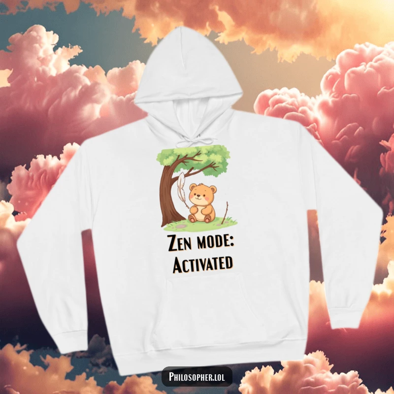 Funny happy bear sits under a tree, pondering a floating feather, a cozy hoodie for peaceful contemplation.