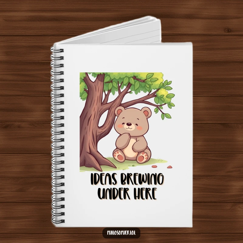 Funny notebook with a happy bear sitting under a tree, deep in thought, perfect for jotting down ideas.