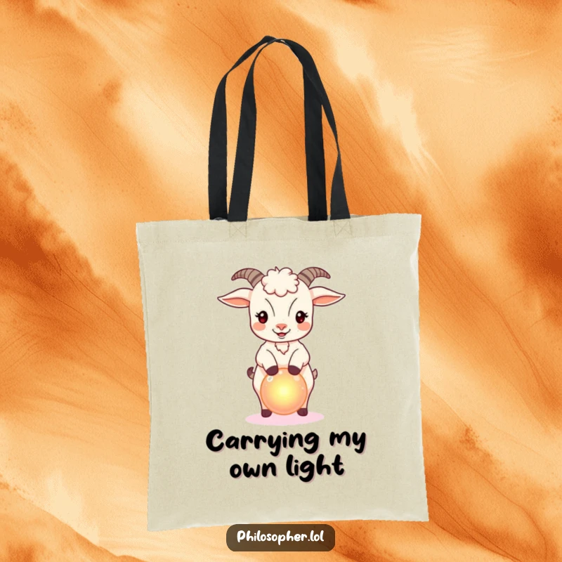 Funny tote bag featuring a bouncy goat balancing a small, glowing orb, ideal for carrying magical finds.