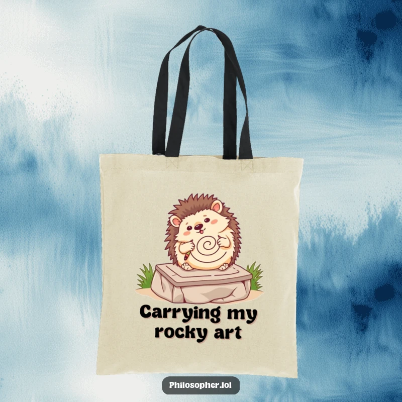 Funny hedgehog tote bag, wobbling hedgehog drawing a spiral on a stone tablet, art supply carrier, cute animal graphic.